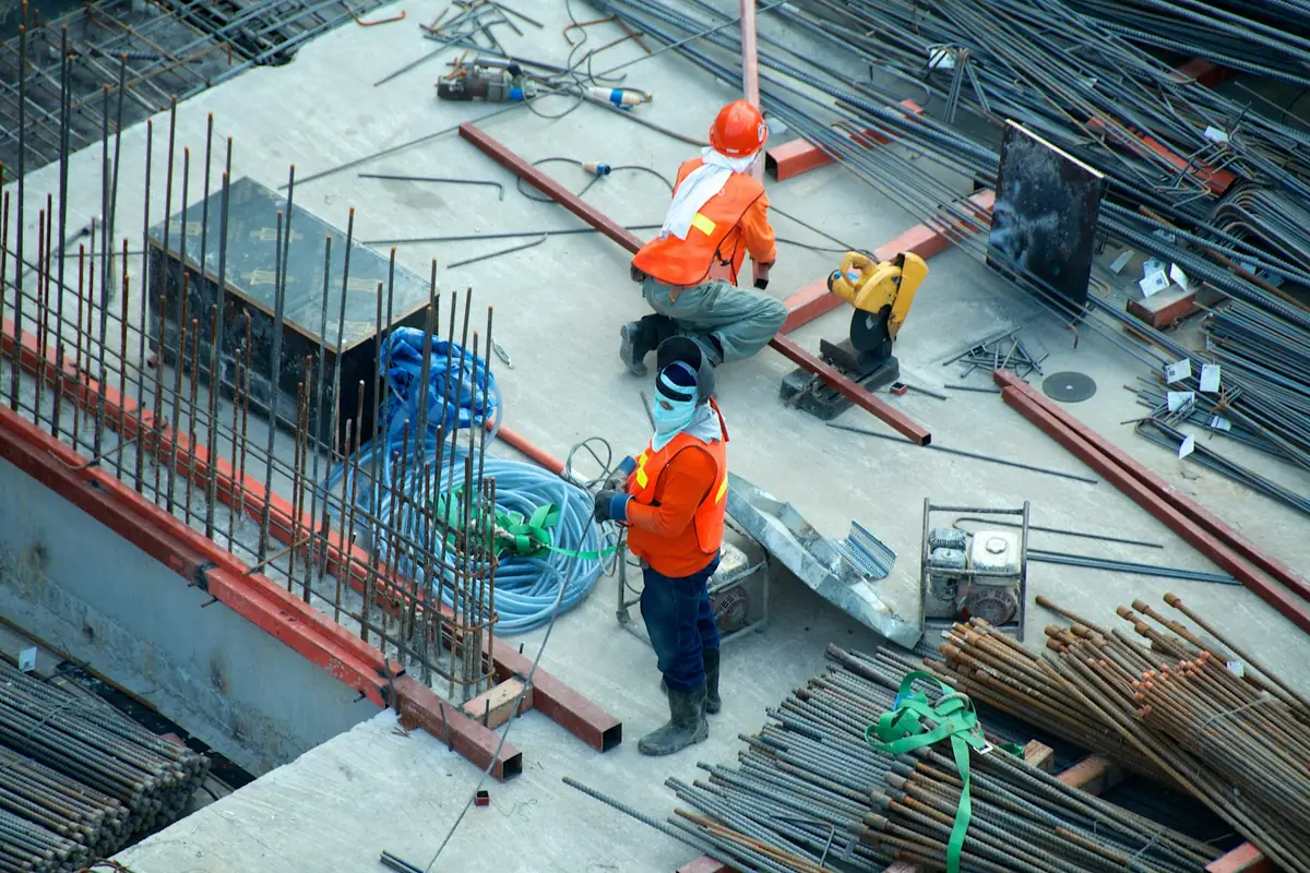 Two contractors working together on a commercial construction site