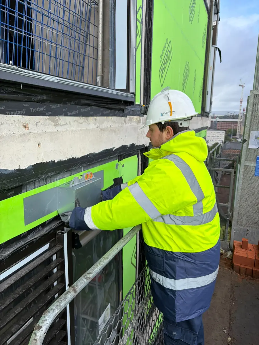 Cliventa operative installing a ventilation louvre
