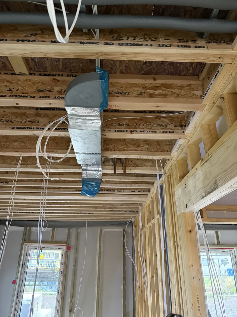 Ventilation ductwork installation within a timber structure