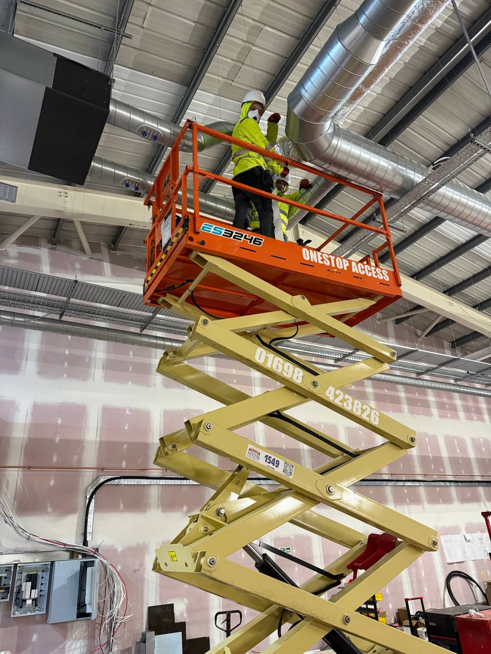 Cliventa Engineering ductwork installation team on elevated platform